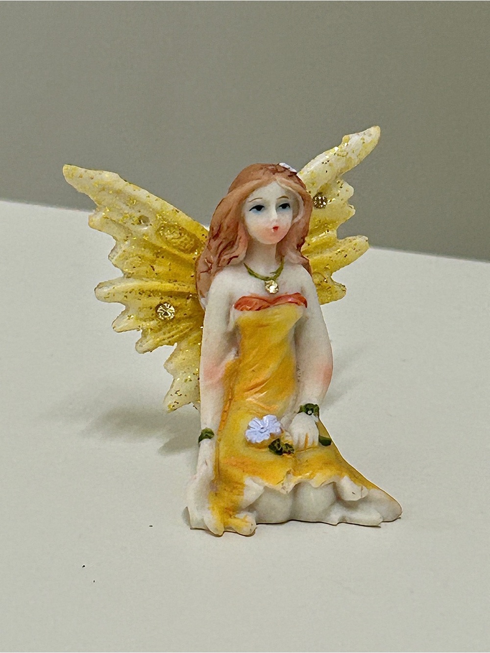 Sculpted Resin Composite Flower Clutching Winged Female Faerie Figurine